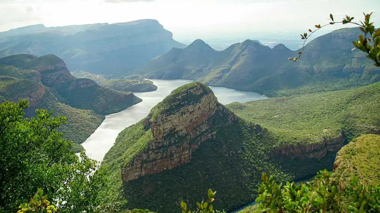 Scenic view of Blyde River Canyon in South Africa with lush green cliffs and winding river — one of the best destinations in Africa.