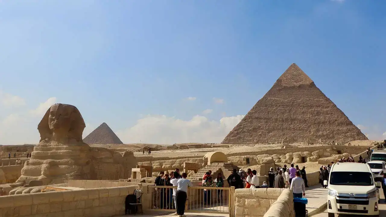 Panoramic view of the Pyramids of Giza near Cairo at sunset, showcasing one of the best destinations in Africa.