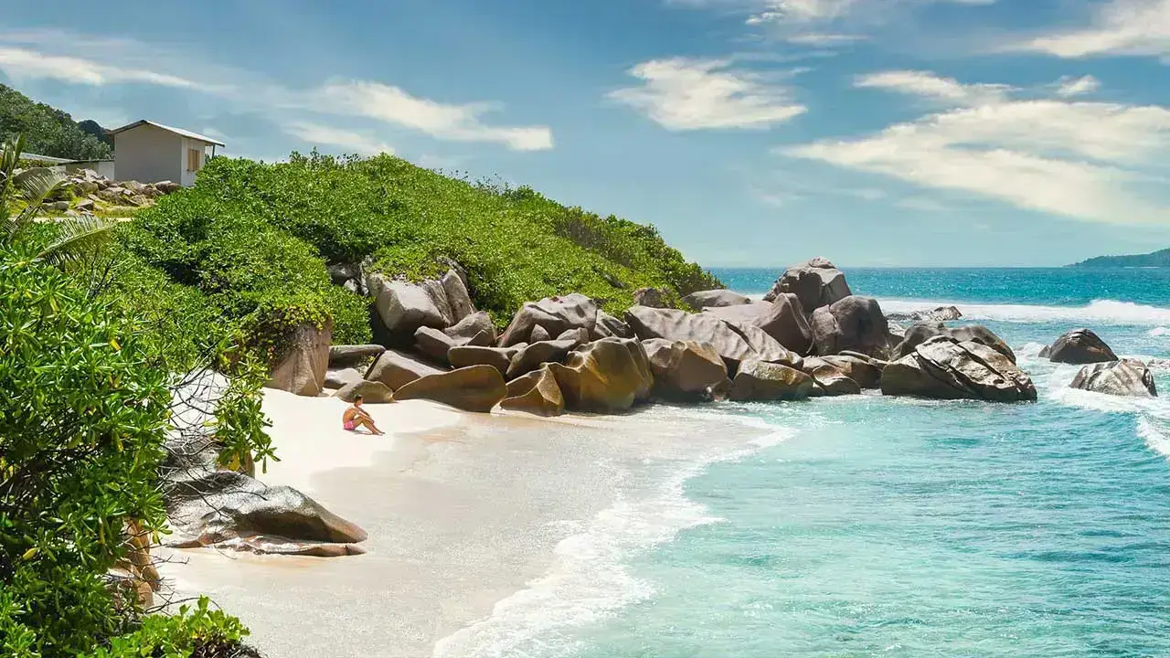 Tropical beach in Seychelles with turquoise water and palm trees, one of the best destinations in Africa.